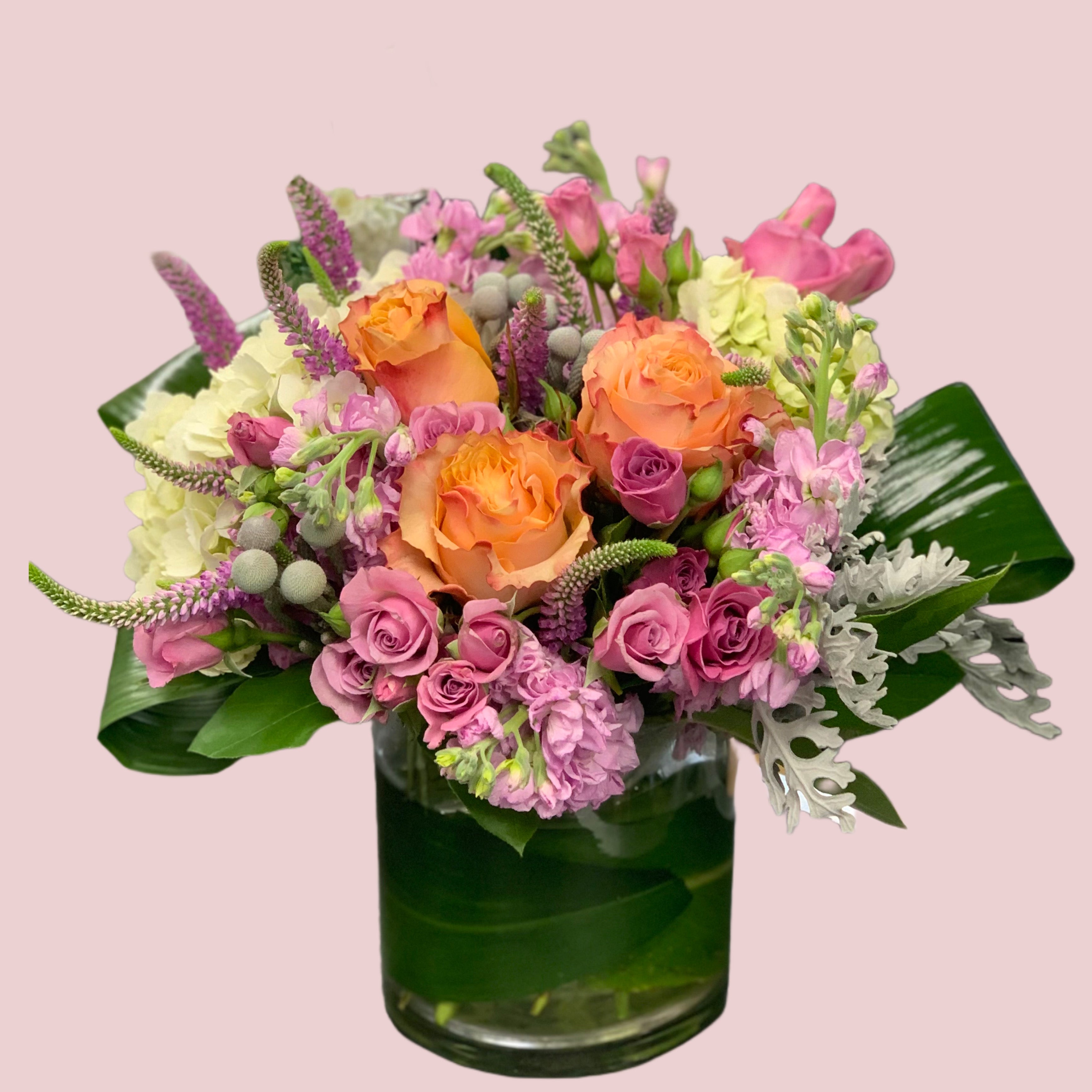 Vibrant  orange, pinks and white arrangement