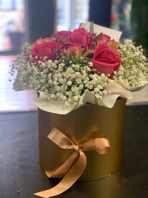 Celebrate with a Box of Flowers and Cake or truffle.